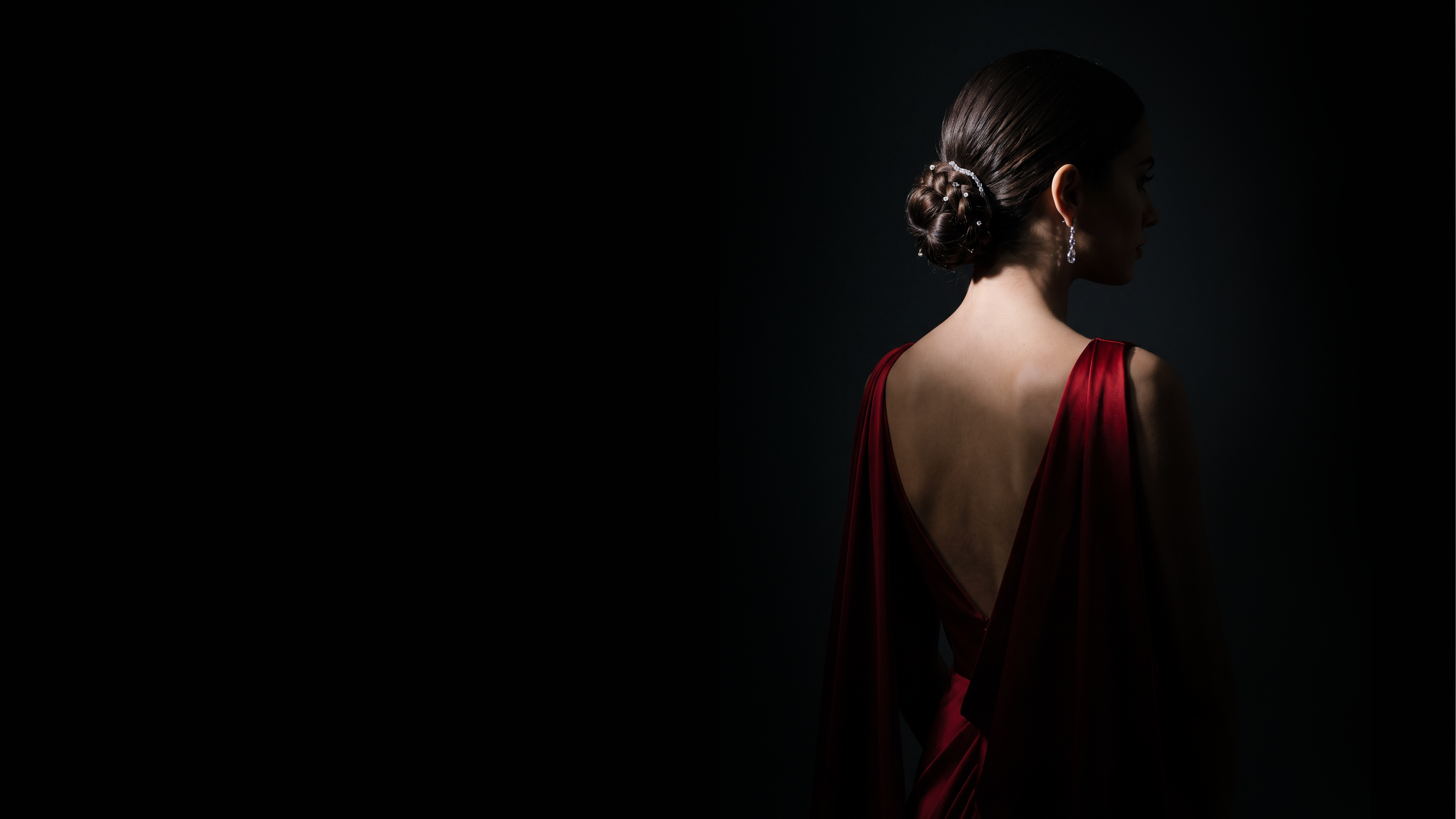 A cinematic portrait of a woman in a red gown